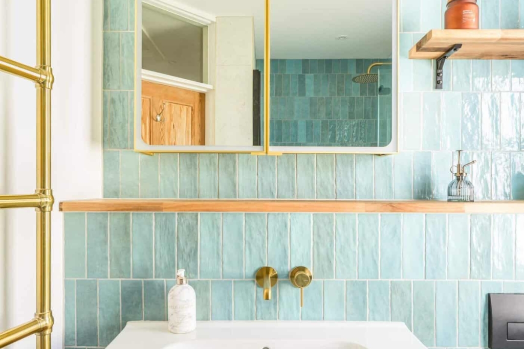 Contemporary bathroom with white vanity, round mirror, and modern fixtures