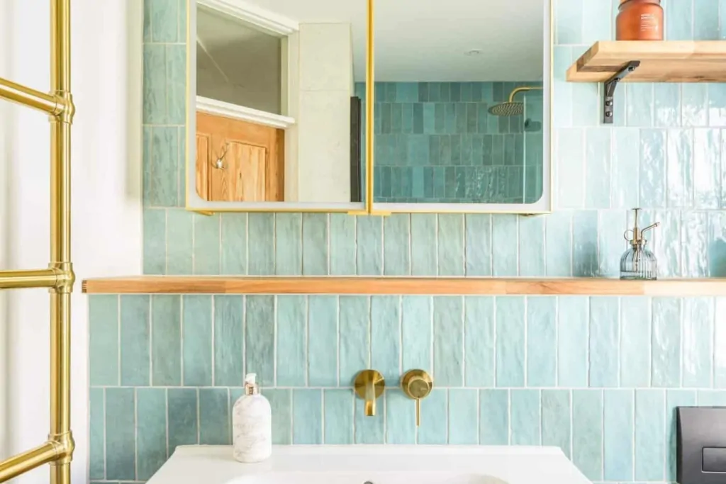 Contemporary bathroom with white vanity, round mirror, and modern fixtures