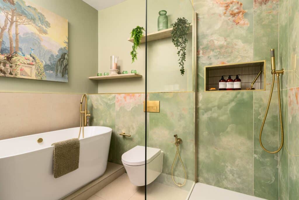 Contemporary bathroom with freestanding bathtub and wall-mounted sink unit