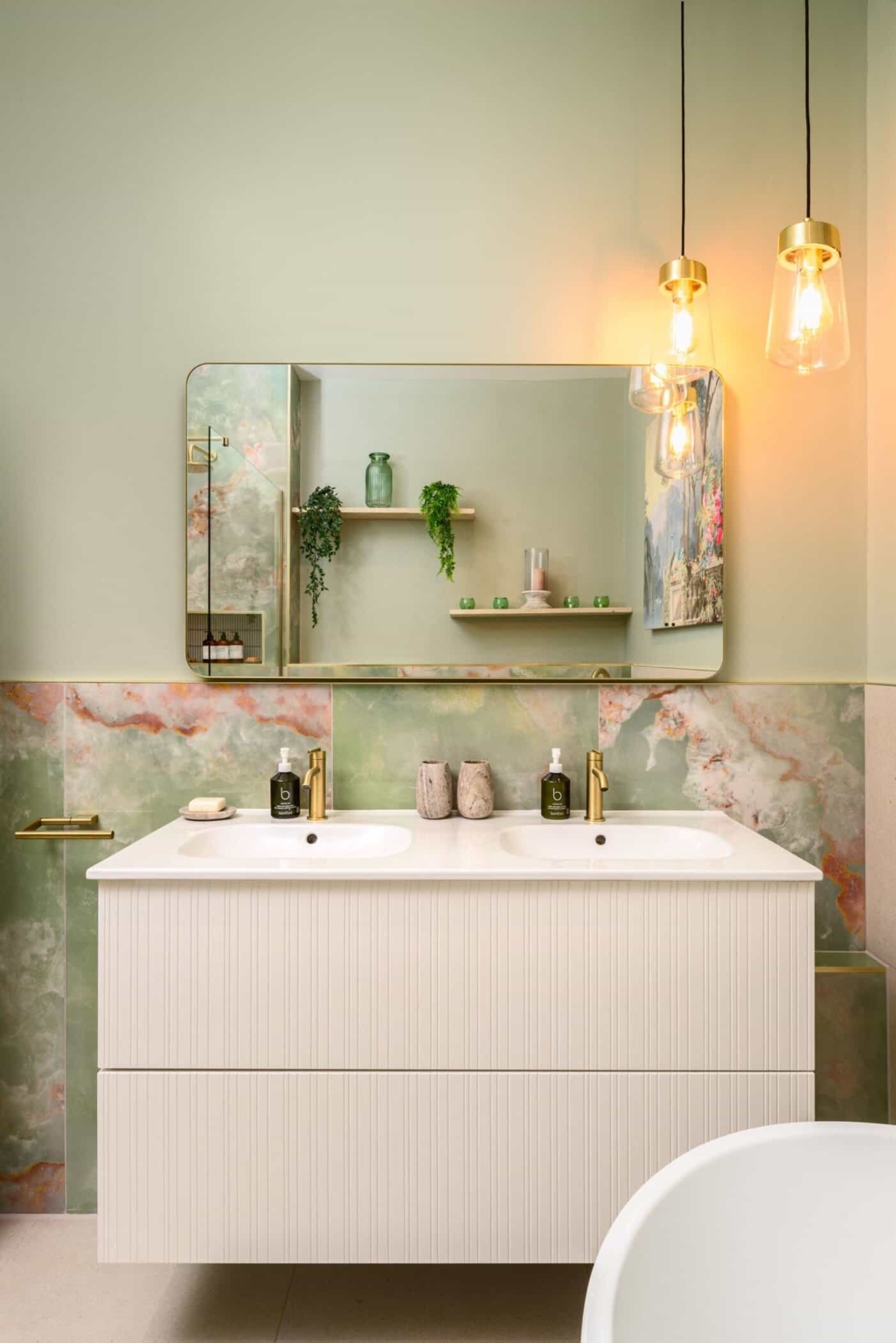 Luxury bathroom with freestanding tub and modern vanity unit.