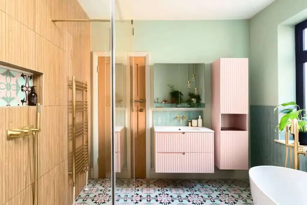 Modern bathroom with pastel green walls, timber vanity and walk-in shower