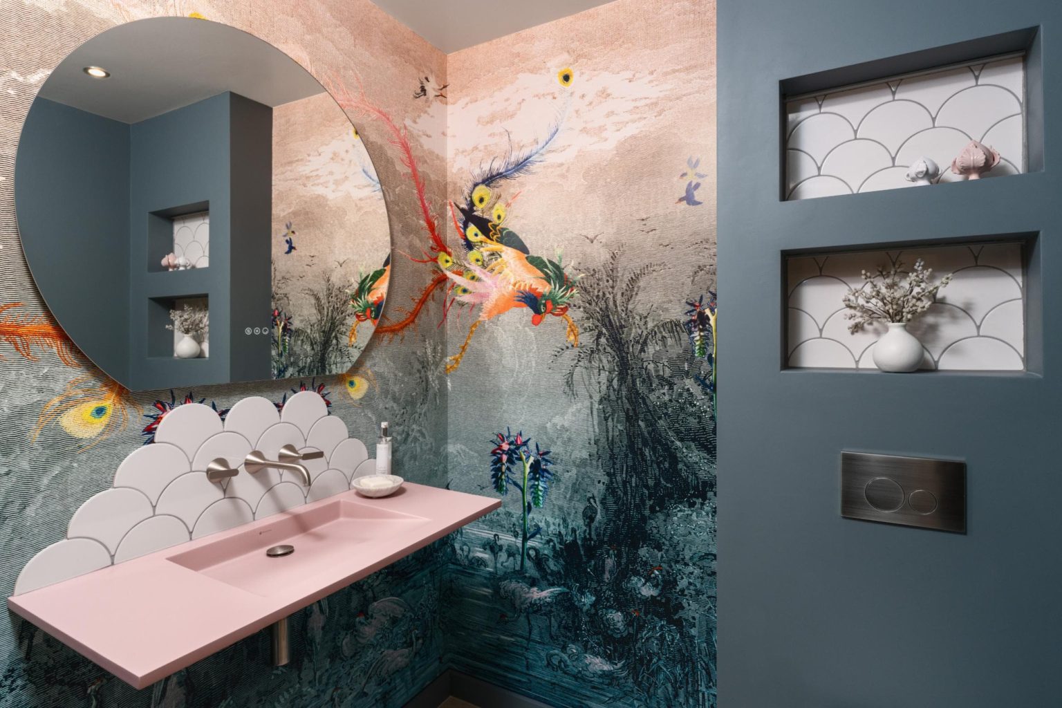 Statement bathroom with artistic mural wall and pink vanity