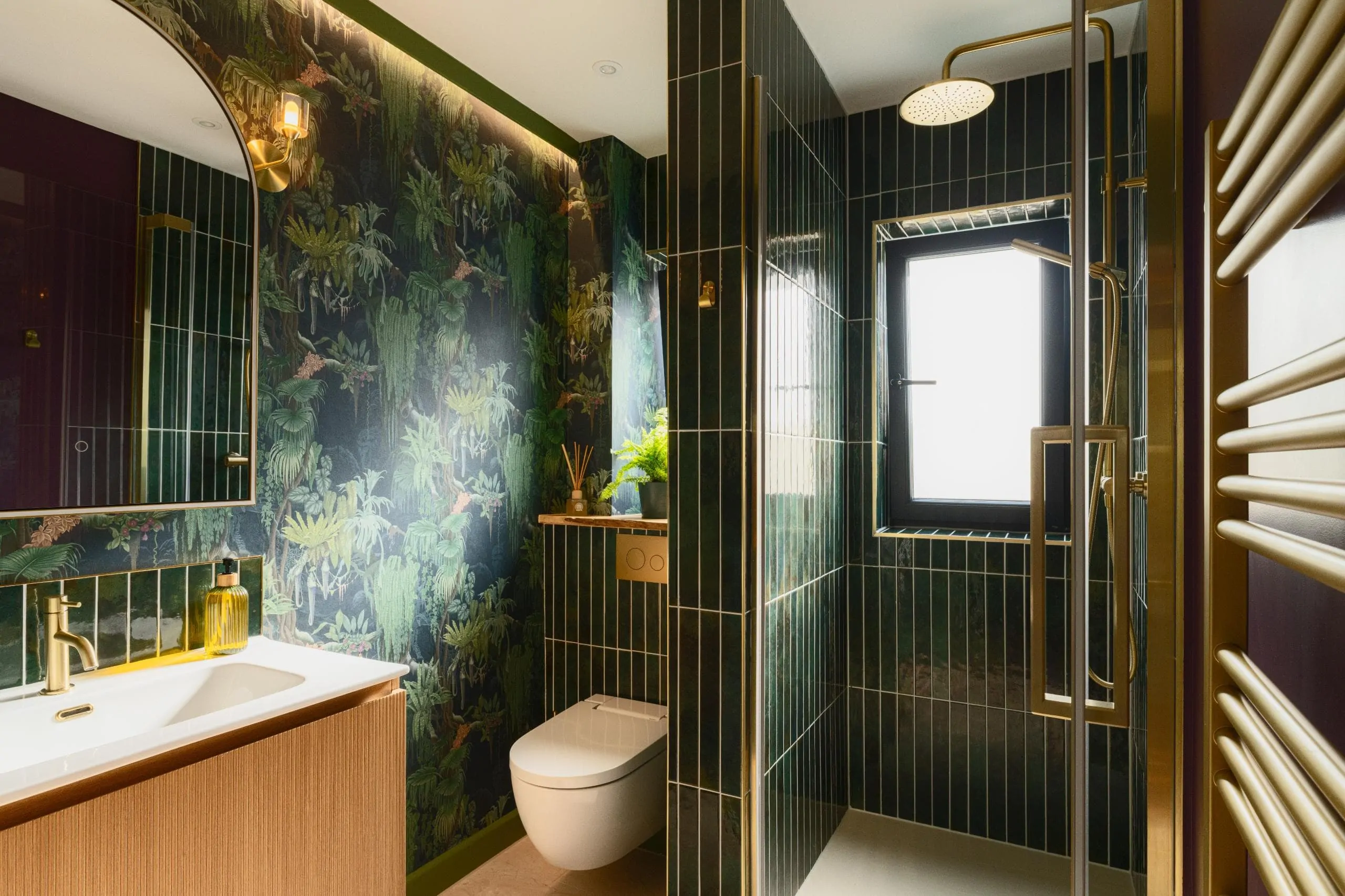 Contemporary luxury bathroom with dark finishes and botanical wallpaper