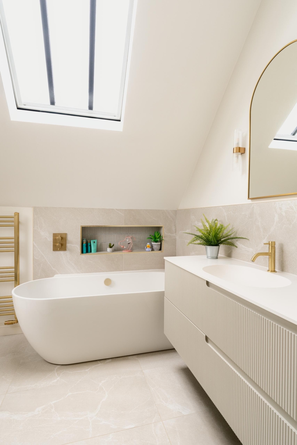 Light contemporary bathroom with skylight and built-in storage