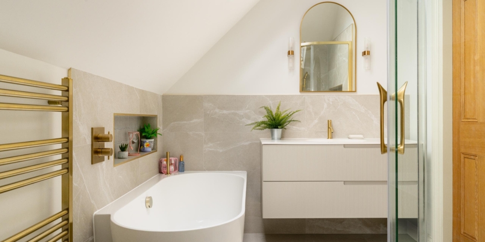 Bespoke neutral bathroom design with shower enclosure and arched mirror