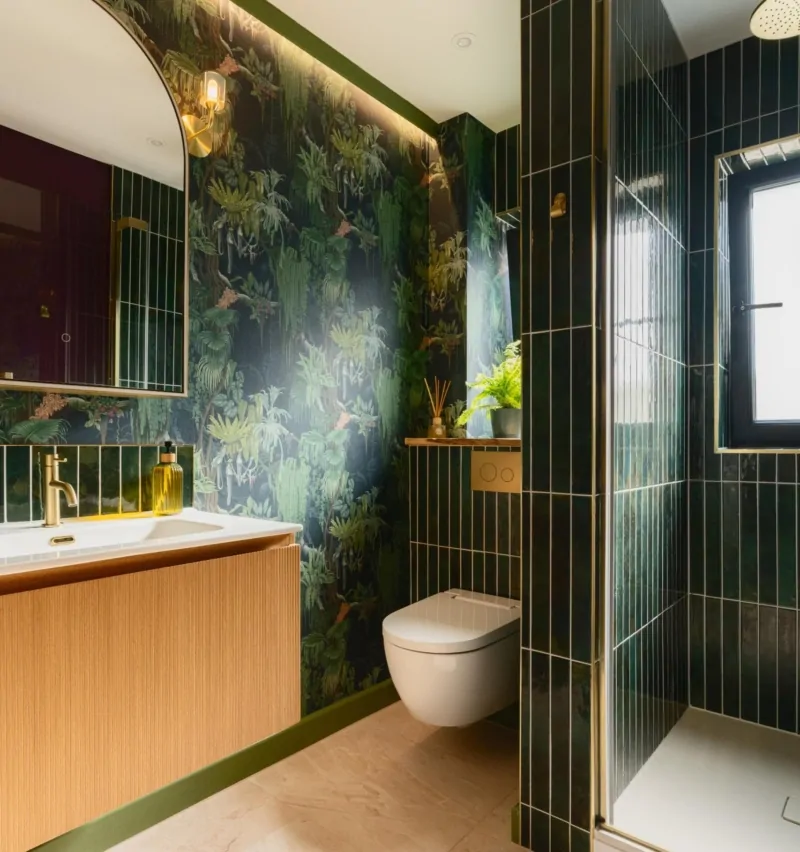 Dark luxury bathroom with vanity, mirror and botanical feature wall
