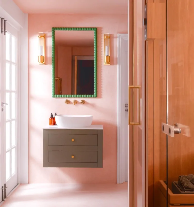 Bespoke pink bathroom with timber detailing, vanity and statement mirror