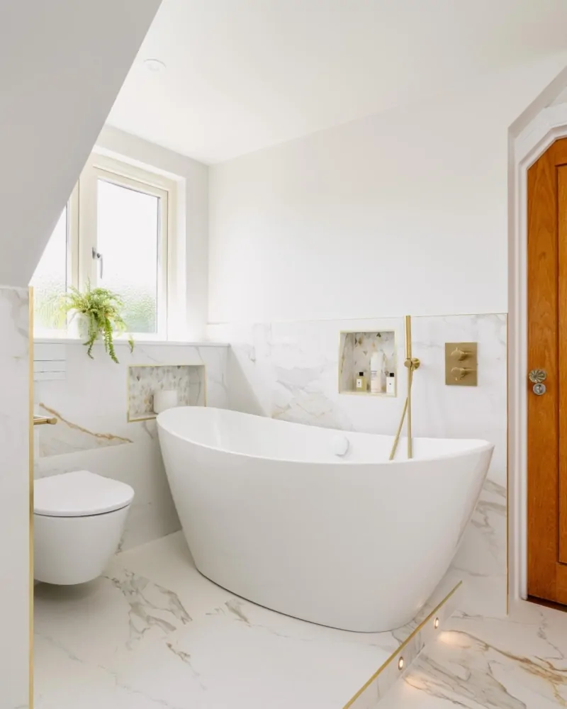 Light neutral bathroom with timber door, window and marble effect finishes