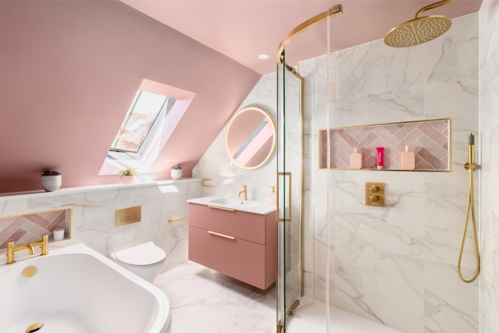 Pink and white marble effect bathroom with skylight and recessed shower storage