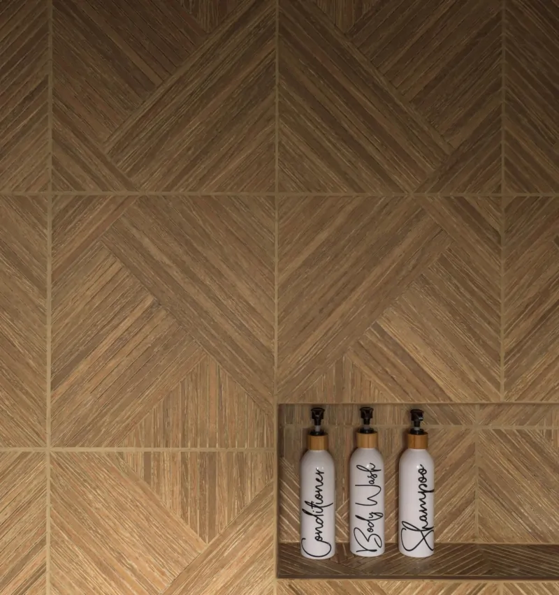 Textured herringbone bathroom tiles in a warm natural finish