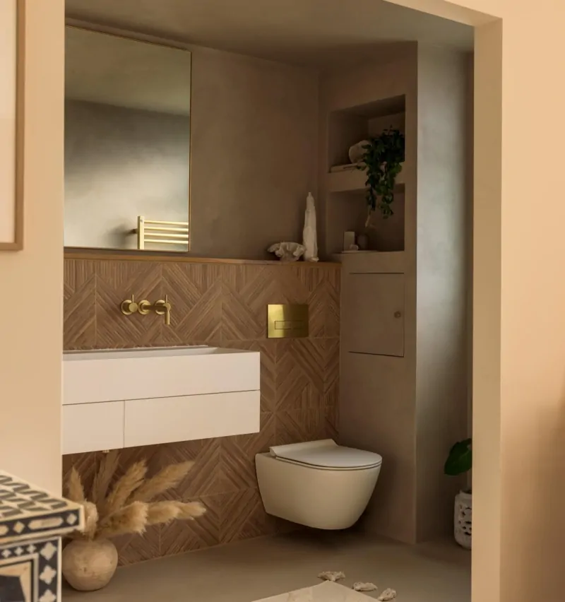Bespoke neutral bathroom vanity with integrated basin and wall storage