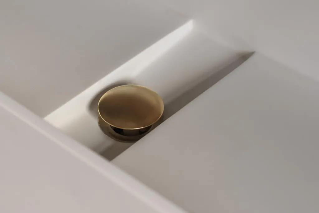 Minimal bathroom styling detail on a light stone surface