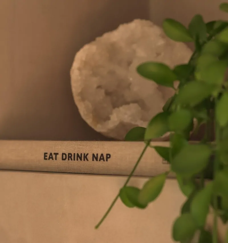Bathroom styling detail with natural accessories, greenery and neutral finishes
