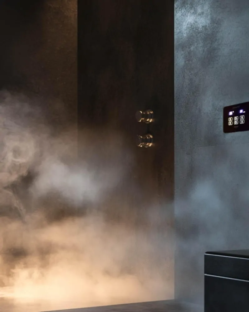 Contemporary steam shower filled with steam and digital controls