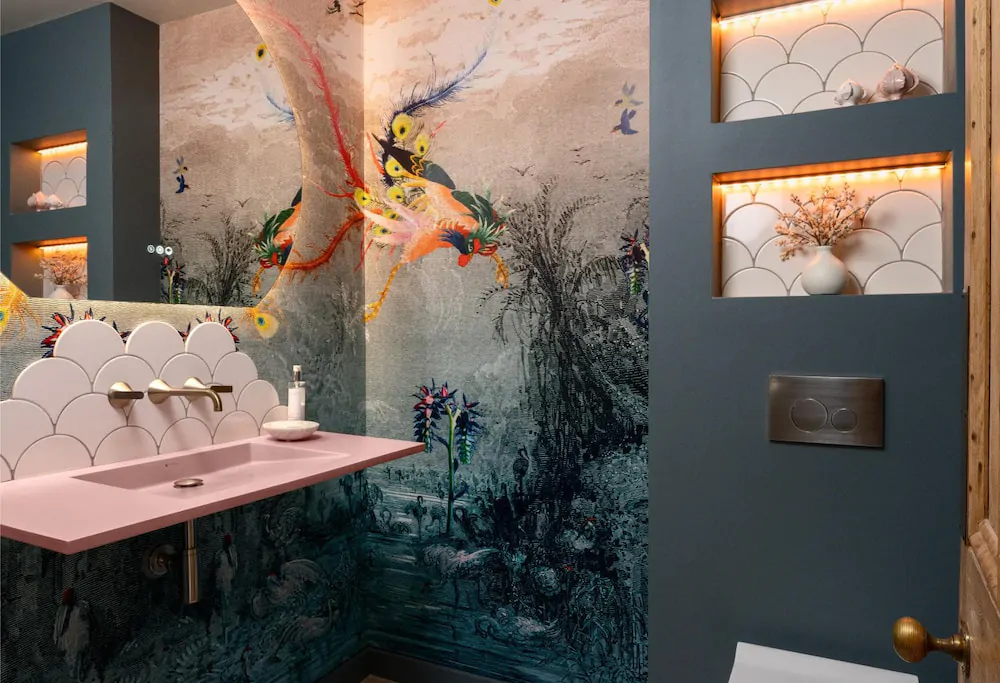 Statement bathroom vanity with artistic feature wall and dark contemporary finishes