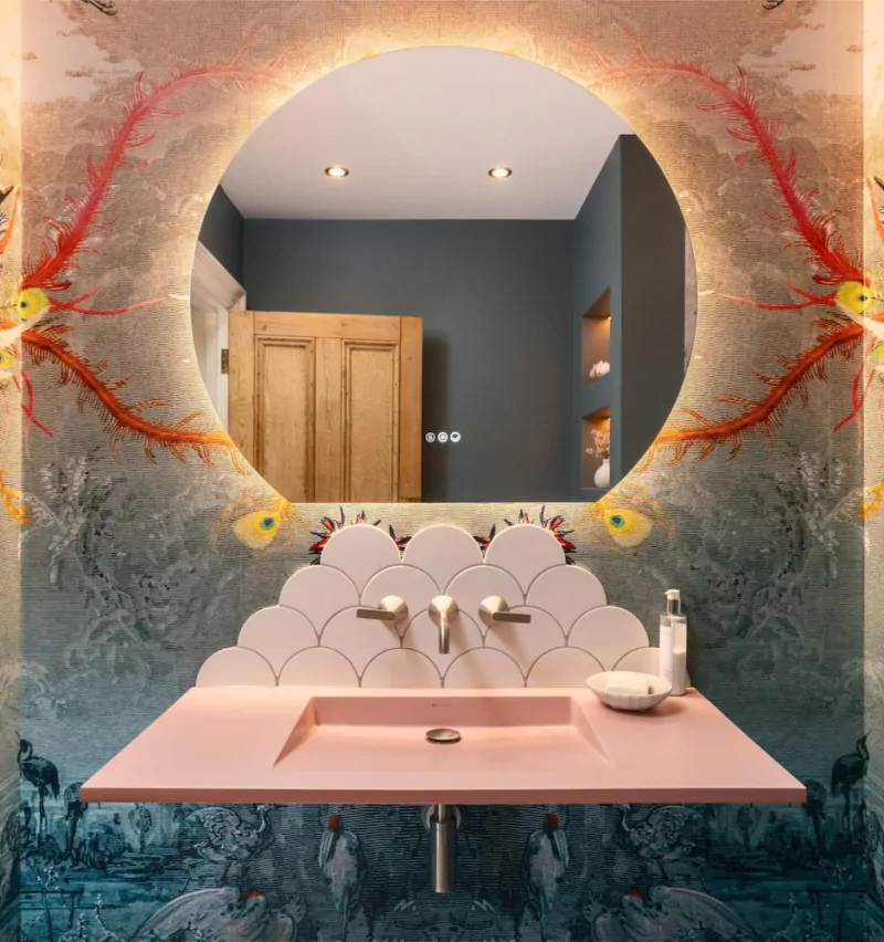 Contemporary vanity with round mirror and colourful statement wall finish